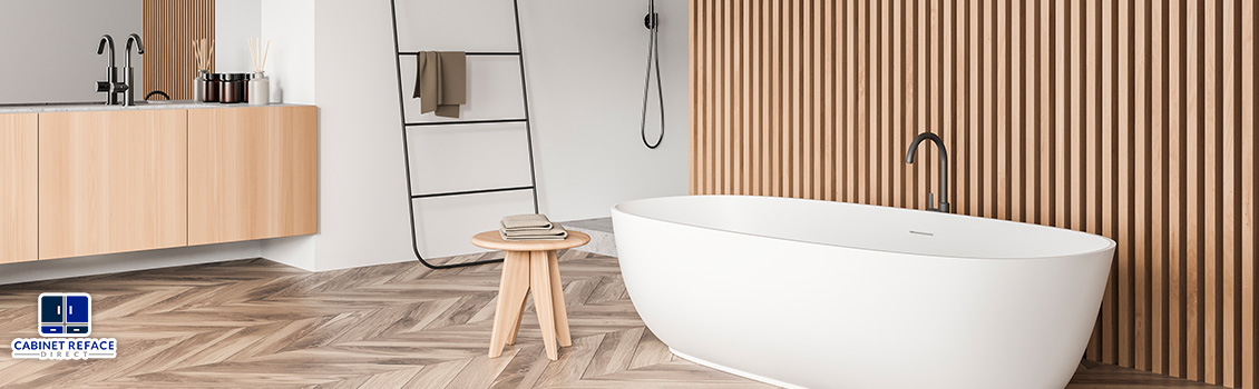 Modern Bathroom With a White Tub and Light Wood Accent Wall Paneling in the Back